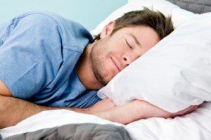 Man sleeping overcoming insomnia